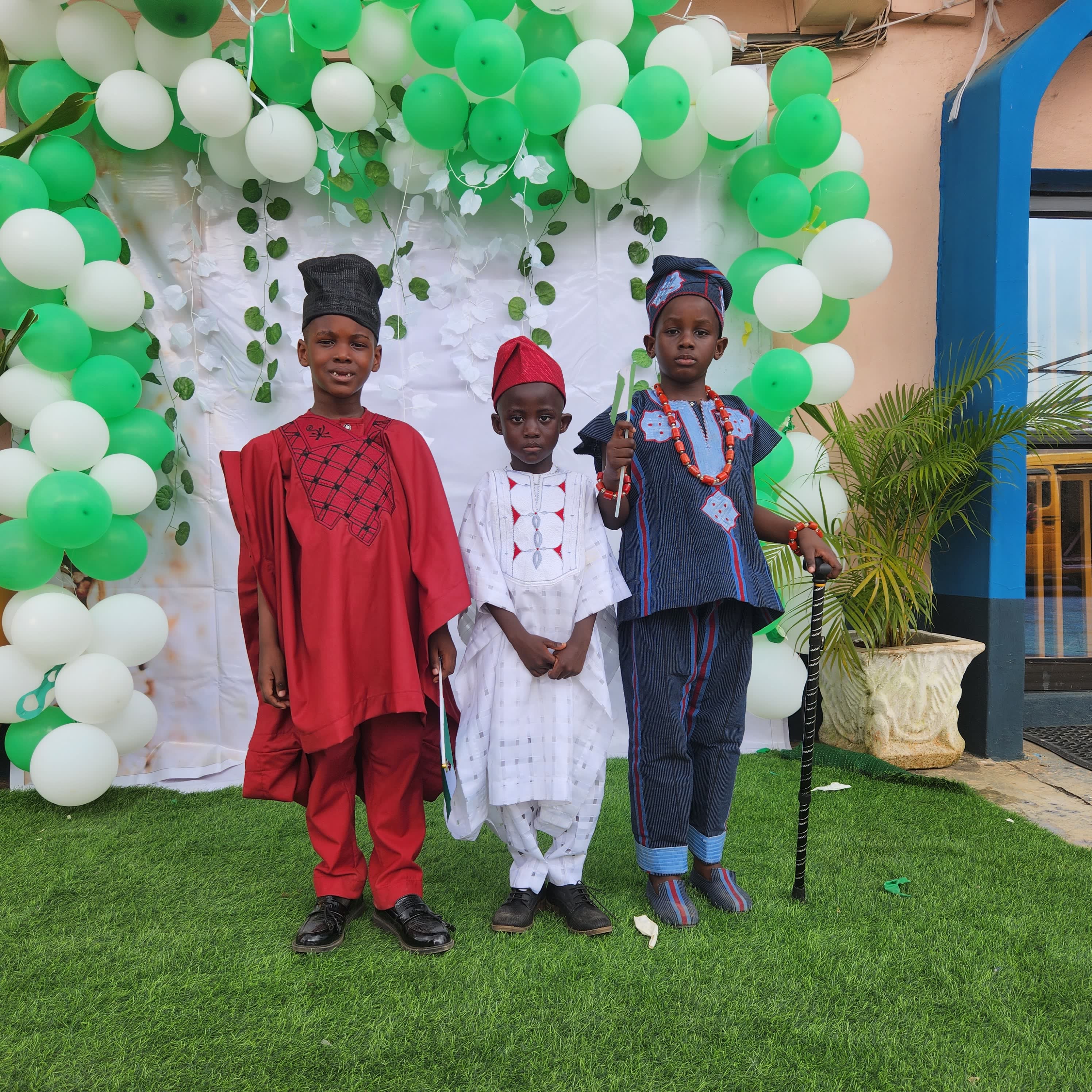 Three Boys in Distinct Regional Outfits